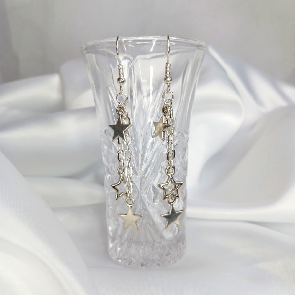 Silver Dangling Set of Stars Earrings.